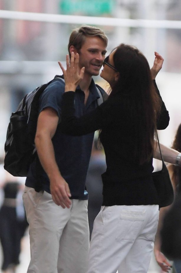 Katie Holmes - On a stroll with a male friend in New York