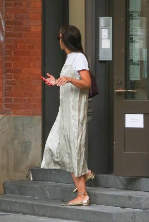 Katie Holmes - Rocks the silver satin dress at the Big Apple in New York