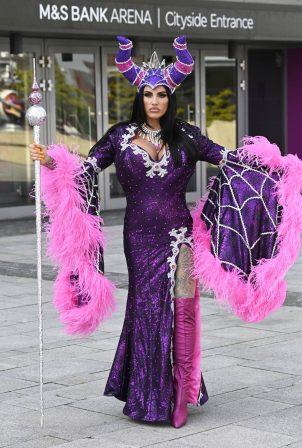 Katie Price - Pictured being dressed in a Cara Bosse at The M and S Bank Arena in Liverpool