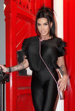Katie Price - Posing in Christian Louboutin trainers during a photoshoot in London