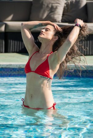 Katie Waissel - In red bikini at a pool during holidays in Italy