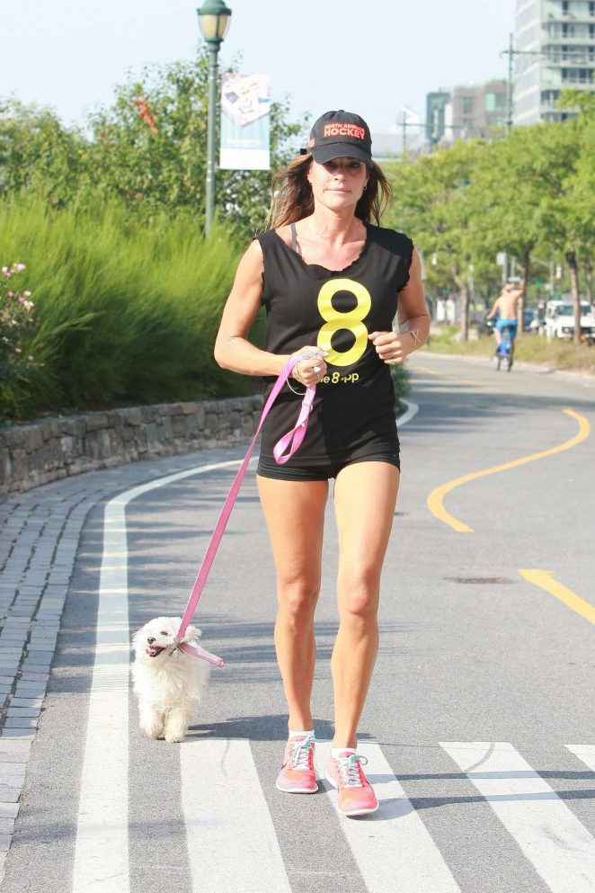 Kelly Bensimon in shorts jogging in Manhattan