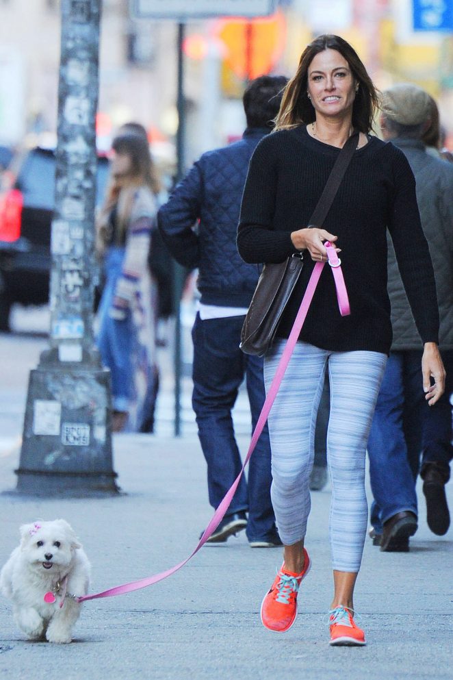 Kelly Bensimon in Tights  with her dog in Soho