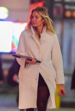 Kelly Bensimon - In white trench coat during an afternoon outing in New York