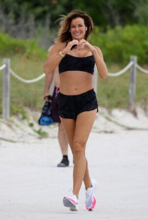 Kelly Bensimon - Jogging on the beach in Miami