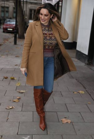 Kelly Brook - in a tan overcoat with sweater at Heart radio in London