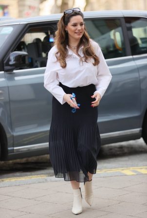 Kelly Brook - In pleated skirt and blouse in London