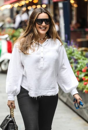 Kelly Brook - In white blouse and black trousers in London