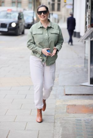 Kelly Brook - In white denim and green top in London