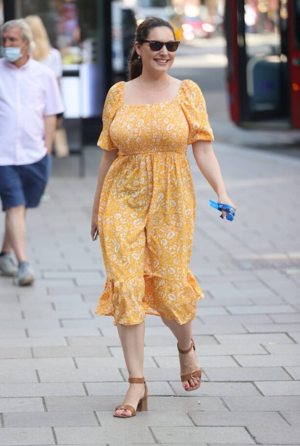Kelly Brook - Pictured in summery yellow mode dress at Heart radio in London