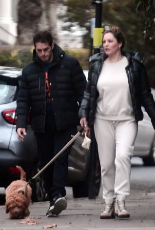 Kelly Brook with her boyfriend Jeremy Parisi walking their dog in North London