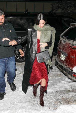 Kendall Jenner - In a red dress and a black leather coat seen in Aspen