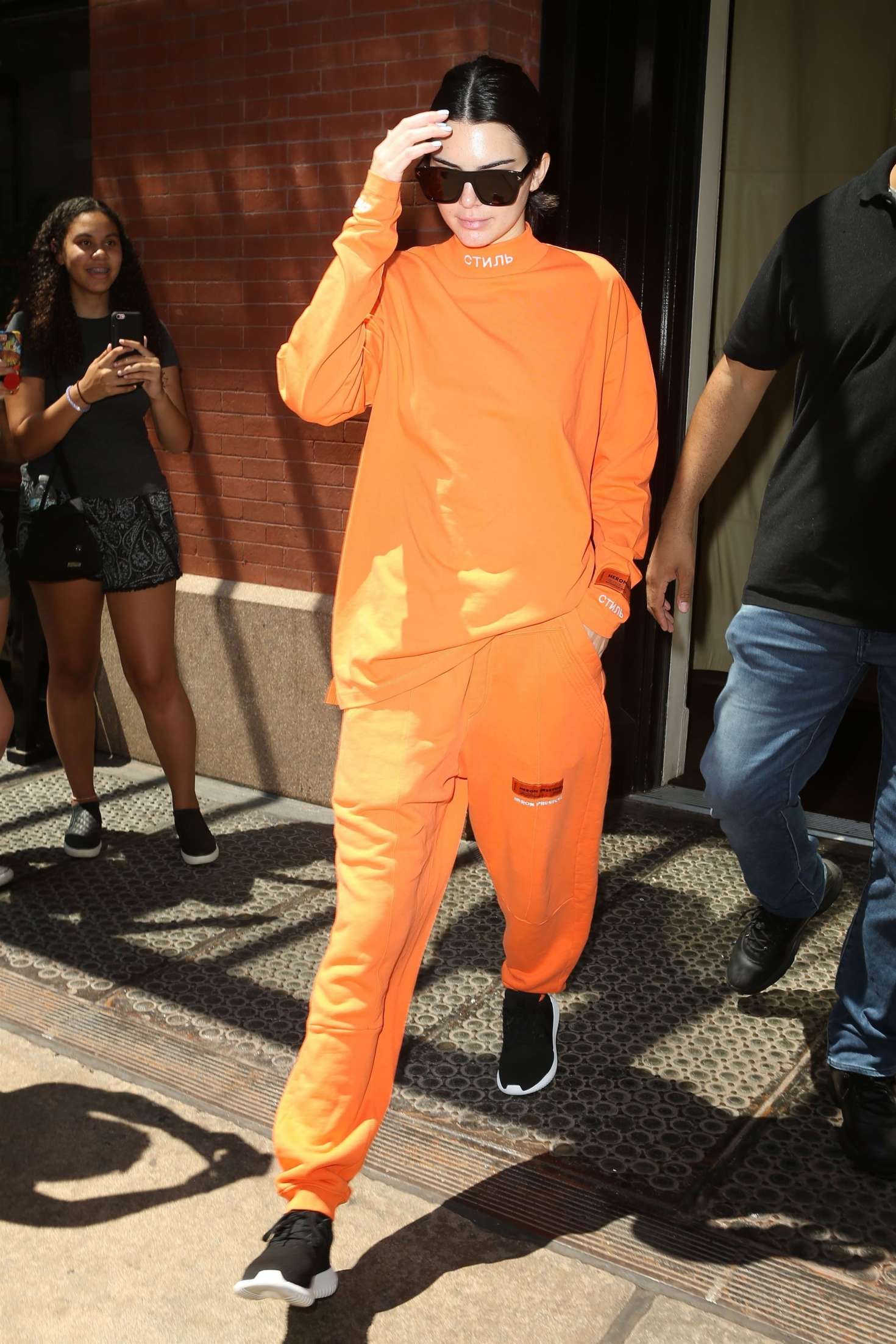 Kendall Jenner in Orange Leaving her hotel -09 | GotCeleb