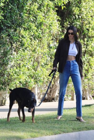Kendall Jenner - With her Doberman Pinscher out for a walk in Beverly Hills