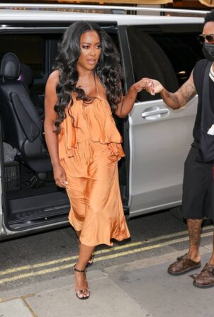 Kenya Moore - Wearing a bright orange dress at Bauer Media offices in London