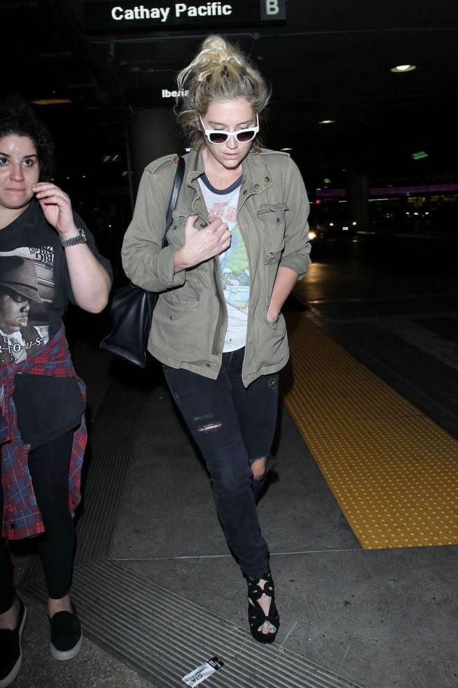 Kesha in Ripped Jeans at LAX Airport in LA