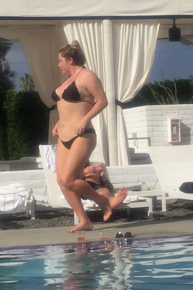 Kesha in Black Bikini at a pool in Palm Springs