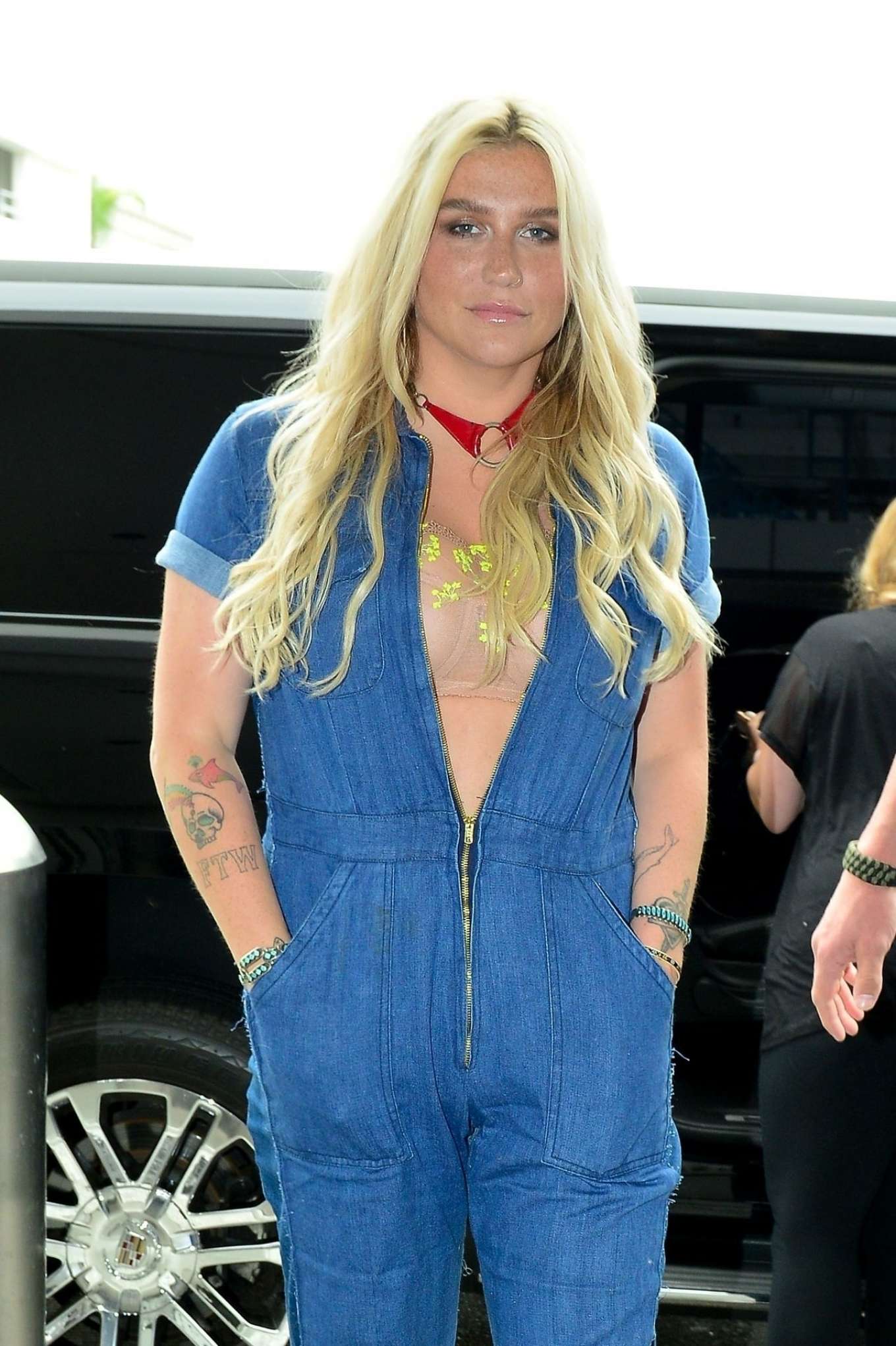 Kesha in Denim Jumpsuit at LAX Airport in Los Angeles