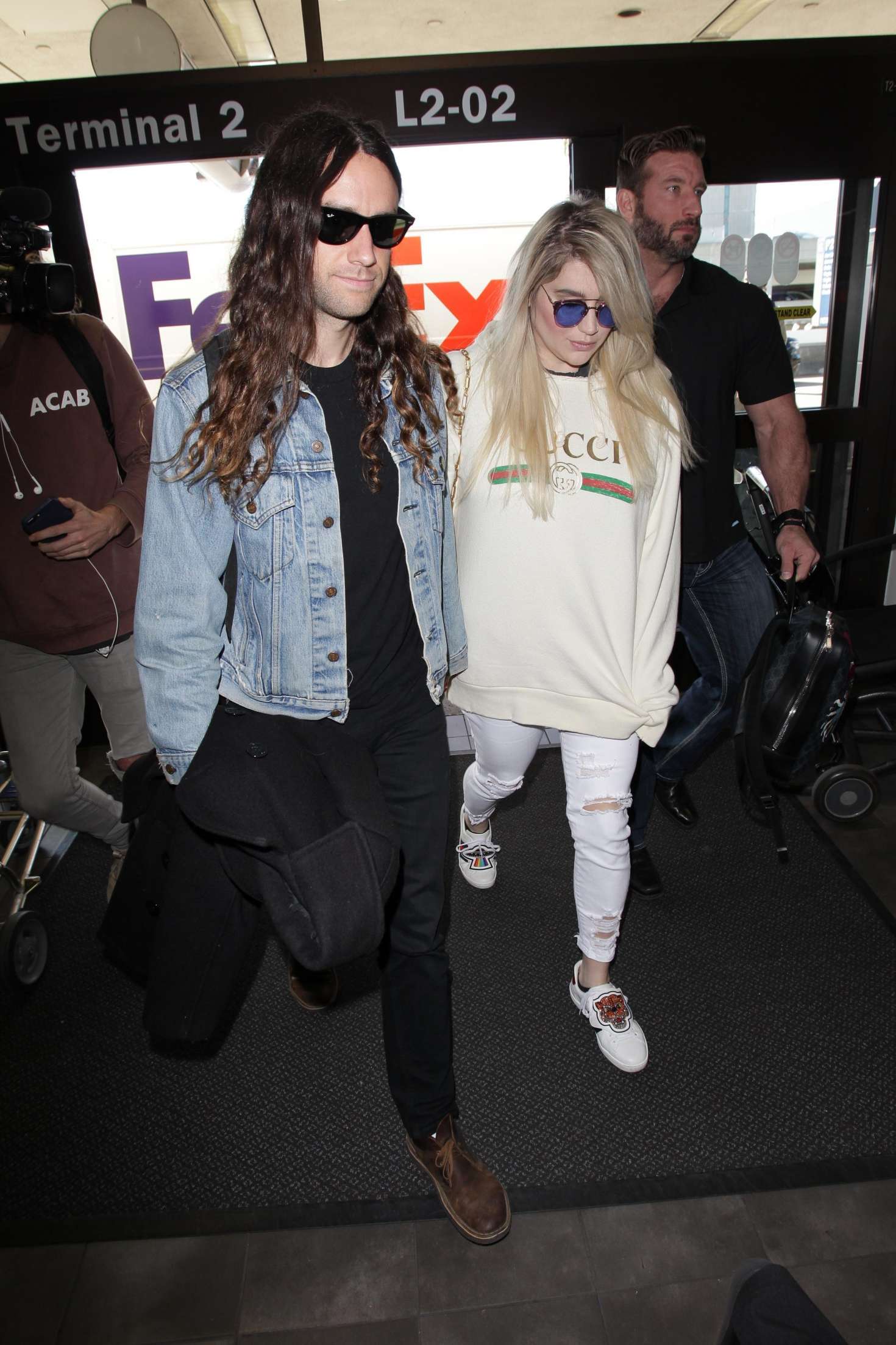 Kesha with her boyfriend Brad Ashenfelter at LAX airport in LA