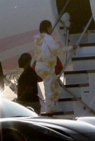 Khloe Kardashian and Kourtney Kardashian - Pictured boarding Kylie Jenner's private jet in Van Nuys