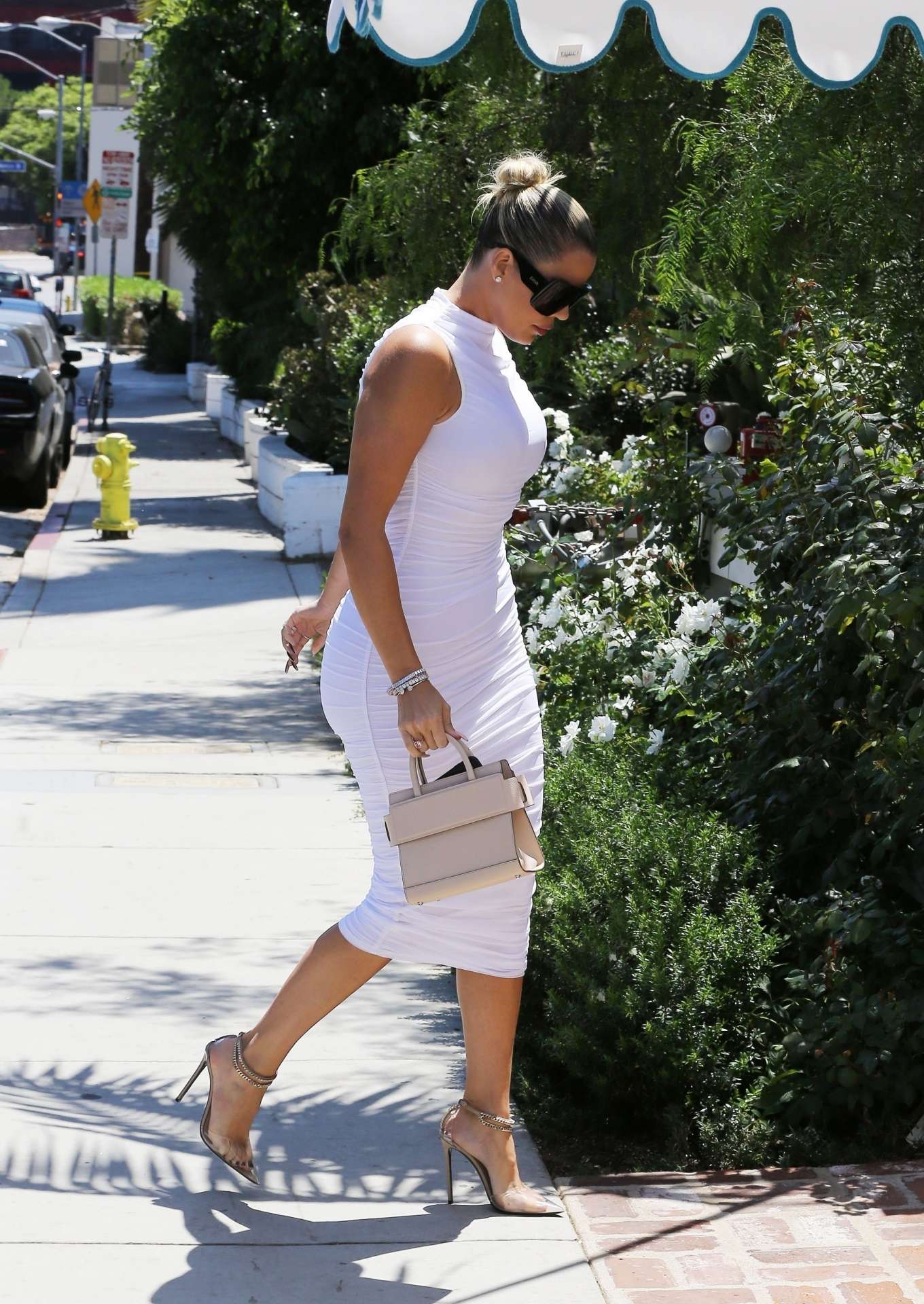 Khloe Kardashian â€“ In a white dress steps out for lunch in Beverly Hills