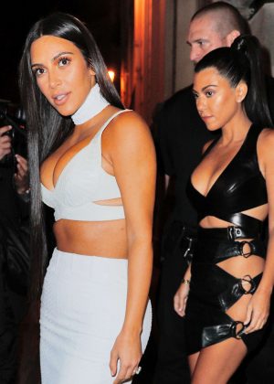 Kim and Kourtney Kardashian in black and white outfits out in Paris
