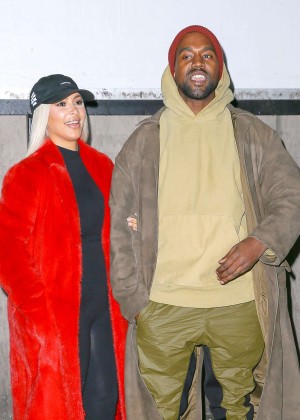 Kim Kardashian and Kanye West Posing in front of YEEZY'S Billboard in NY