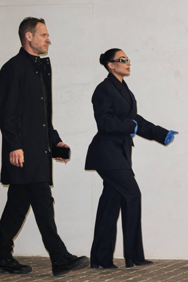 Kim Kardashian - In a black suit with blue gloves arrives at Prada Foundation
