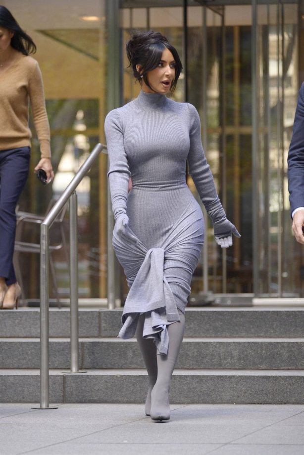 Kim Kardashian - In a tight dress arriving at an office building in New York