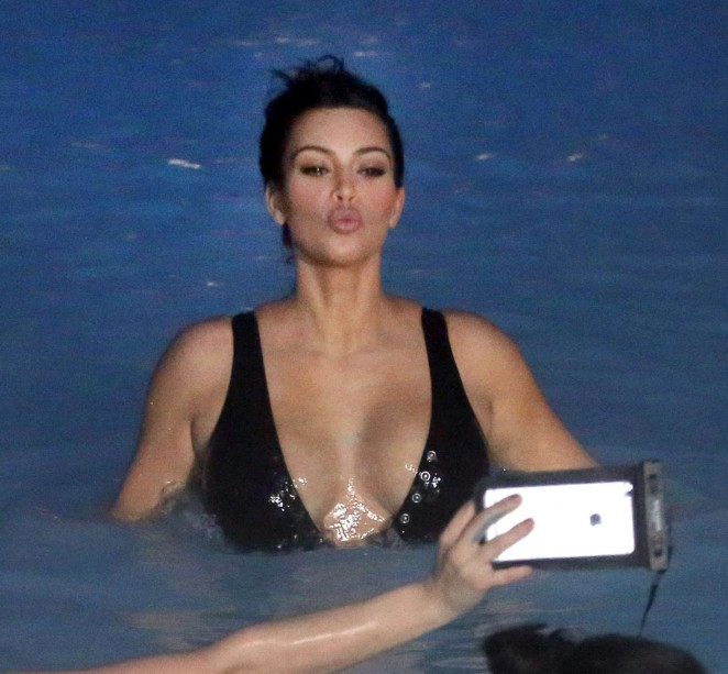 Kim Kardashian in Black Swimsuit in Iceland adds