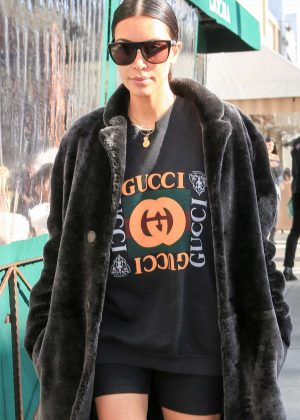 Kim Kardashian in long fur coat and shorts out in Beverly Hills