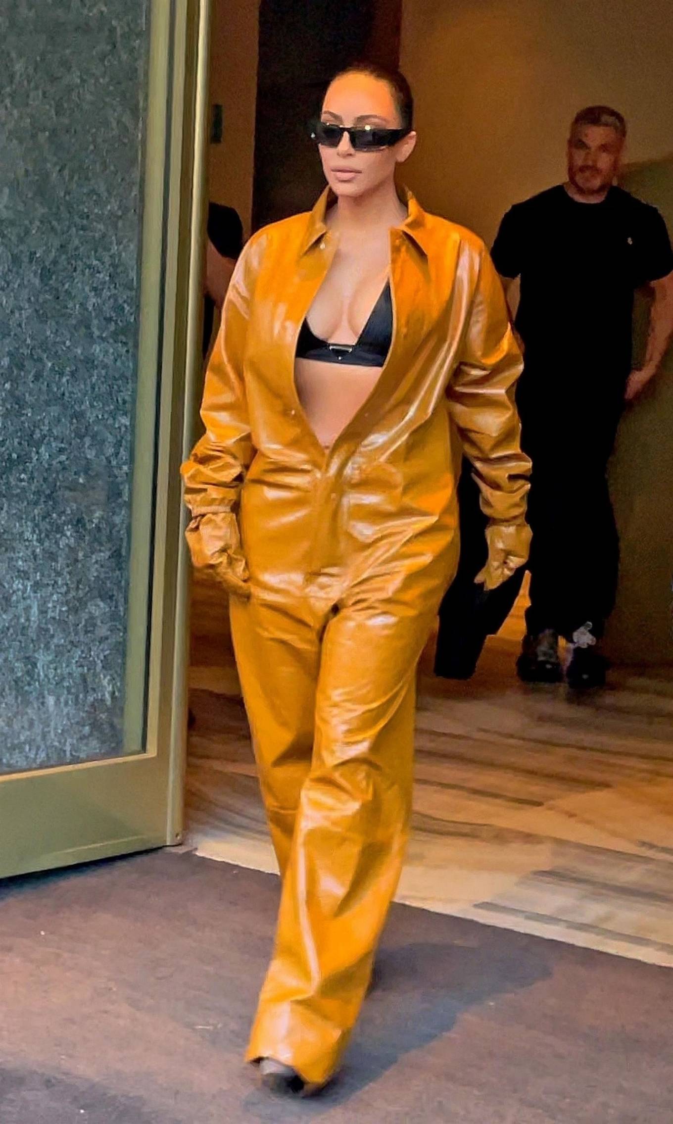 Kim Kardashian – Rocks a PVC leather outfit during Milan