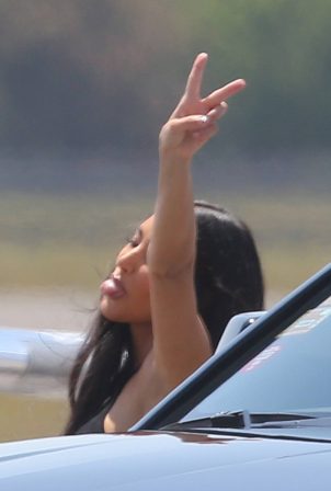 Kim Kardashian - Seen boarding a private jet in Miami