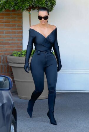 Kim Kardashian - wears a skin-tight black Balenciaga look in Los Angeles