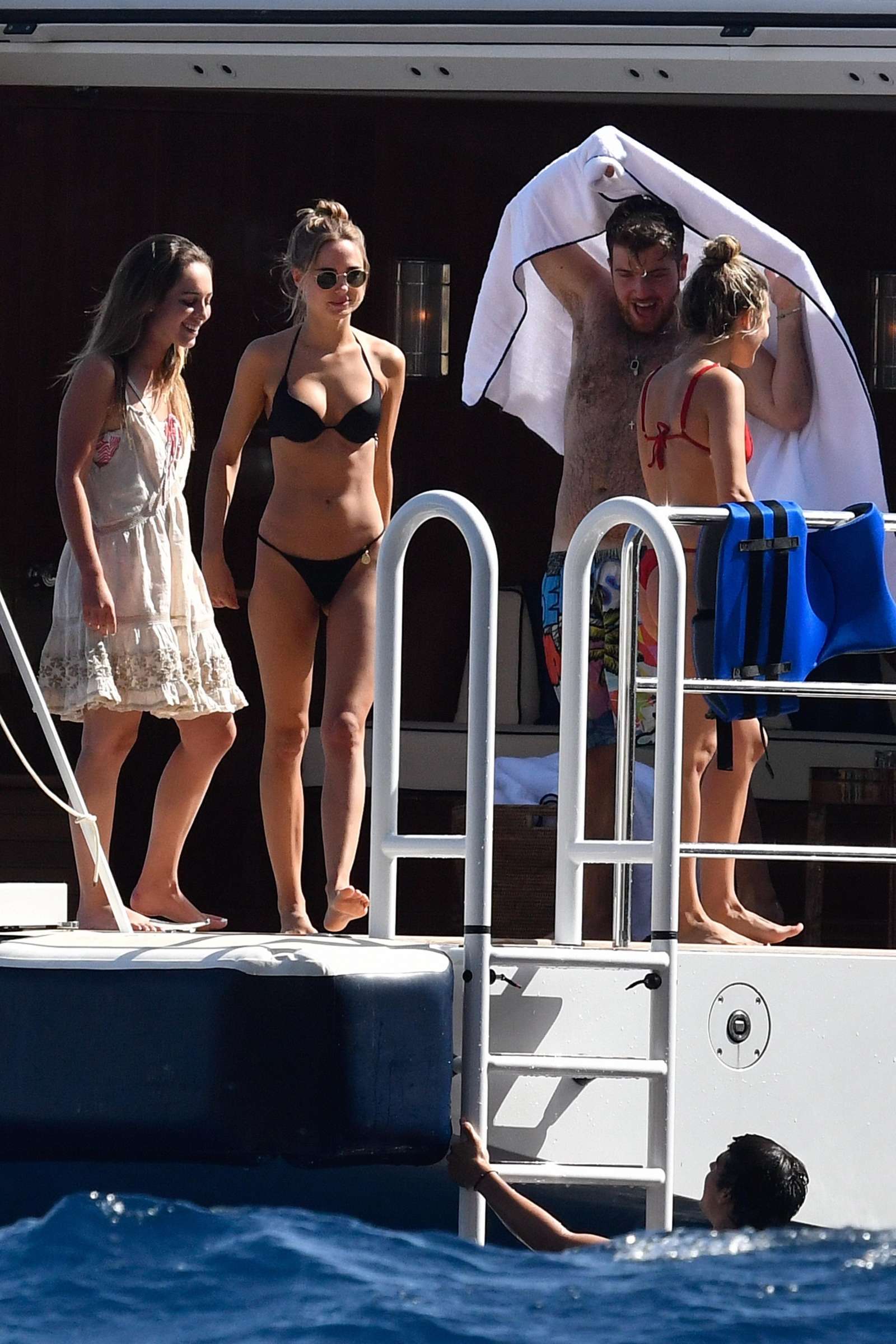 Kimberley Garner in Black Bikini on a yacht in Capri. 