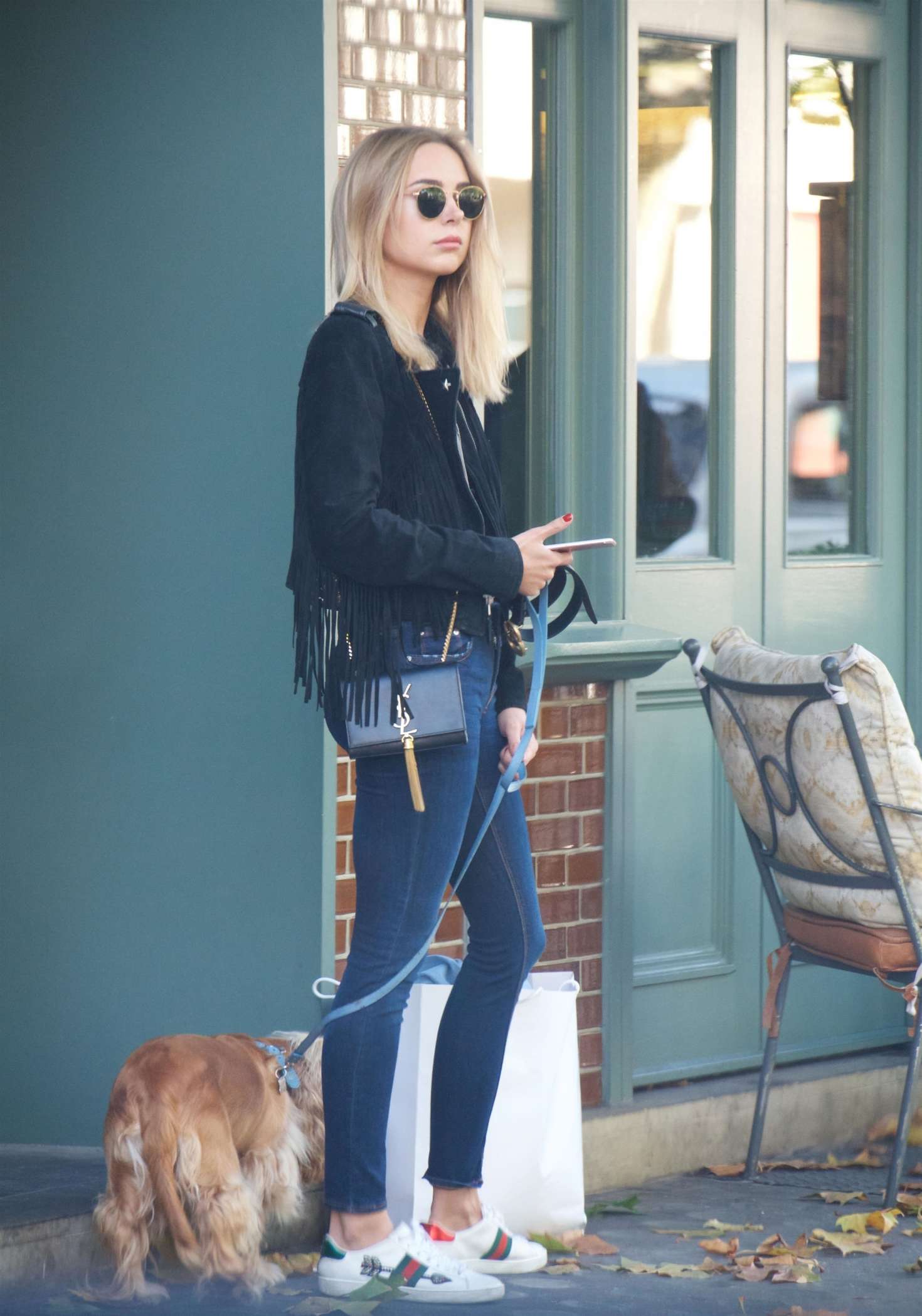 Kimberley Garner walking with a dog in London
