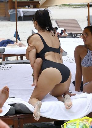 Kourtney Kardashian in Back Swimsuit at a beach in Miami