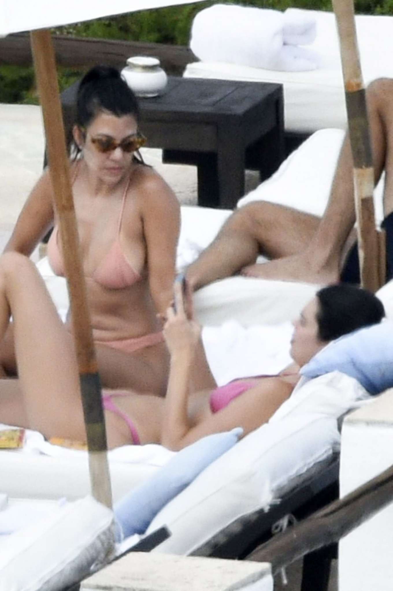 Kourtney Kardashian in Bikini on the pool in Costa Smeralda. 