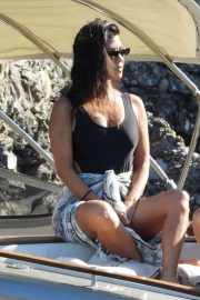 Kourtney Kardashian in Black Swimsuit on a boat in Portofino
