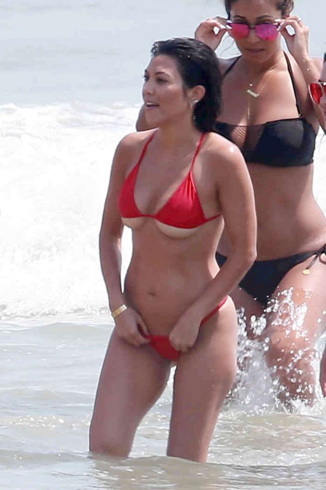 Kourtney Kardashian in Red Bikini at the beach in Tulum