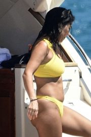 Kourtney Kardashian in Yellow Bikini on a yacht in Corsica