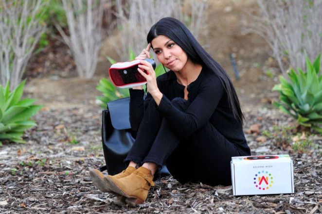 Kourtney Kardashian - Putting together a toy in Los Angeles