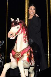 Kourtney Kardashian - Riding on a carousel in Paris