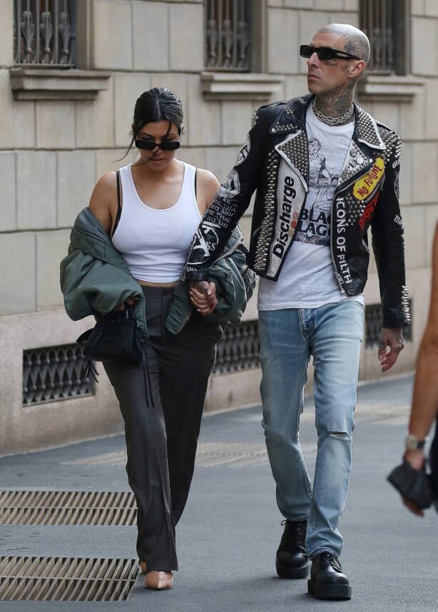 Kourtney Kardashian - With husband Travis Barker holding hands while out in Milan