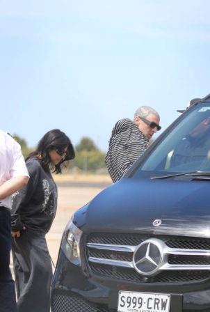 Kourtney Kardashian - With Travis Barker arrive via private jet in Melbourne