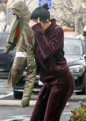 Kylie Jenner - Hides her face at Bui Sushi in Malibu