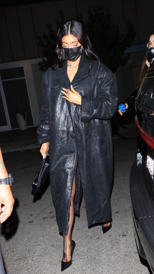Kylie Jenner - Wearing black trench coat while at The Nice Guy in West Hollywood