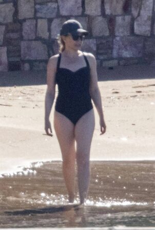 Kylie Minogue - In black swimsuit at the beach in Athens