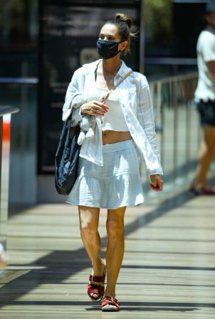 Kyly Clarke - wearing a white mini skirt in Bondi