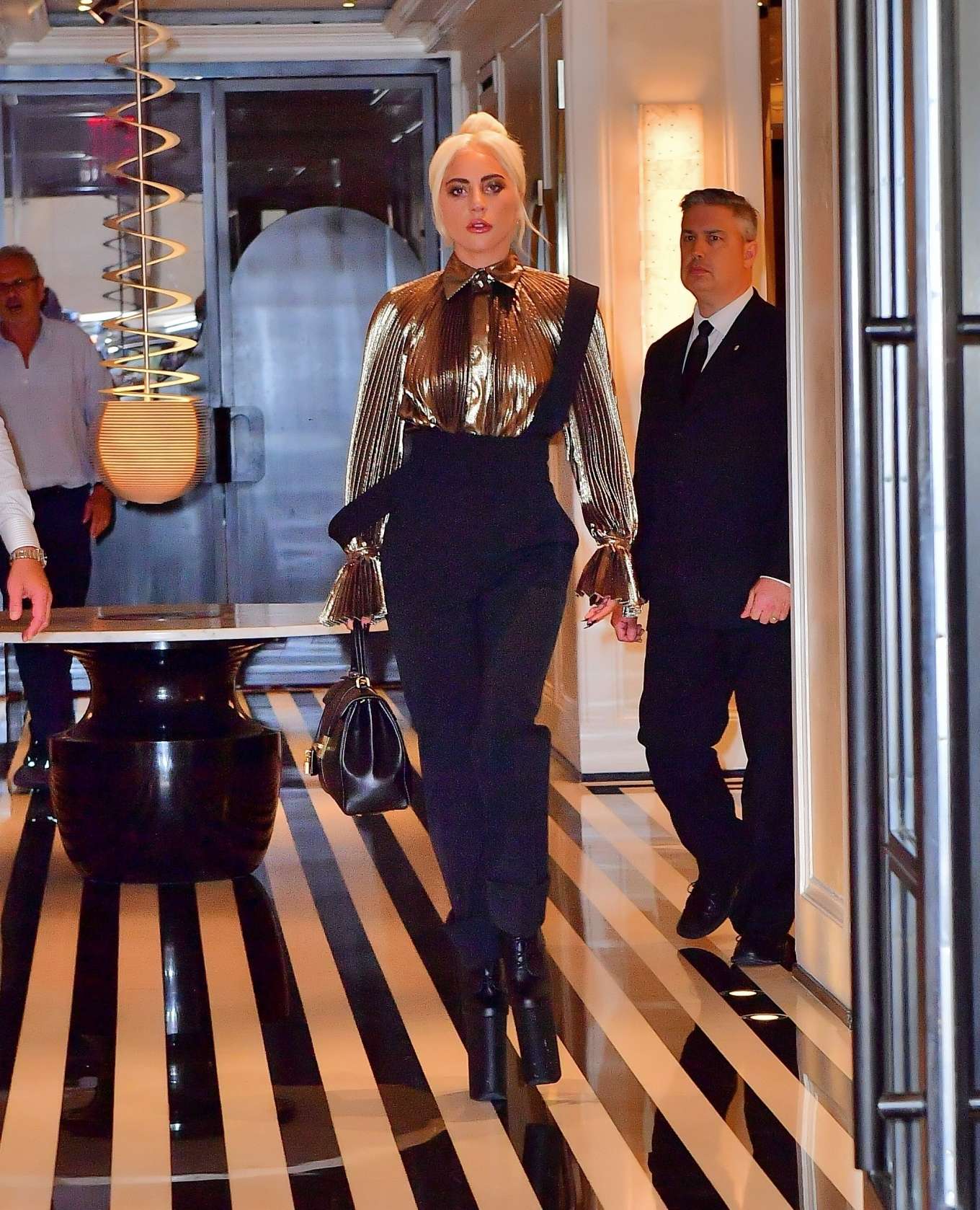 Lady Gaga â€“ Wear Gold Blouse paired with Trousers as she Steps out in New York City